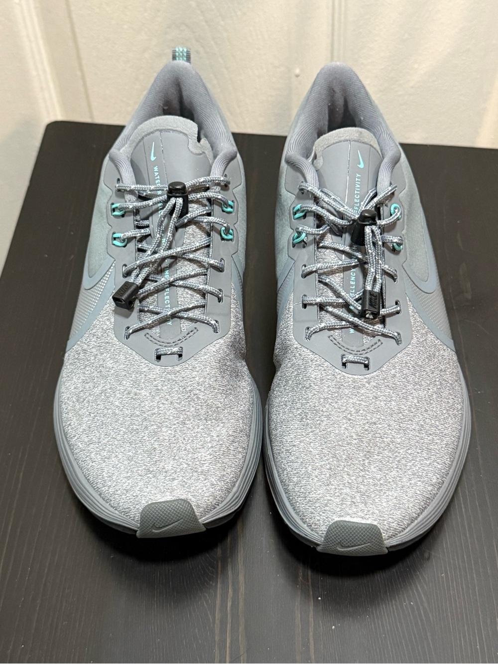 Nike Women's Grey Sneakers with Teal Accents size 7.5